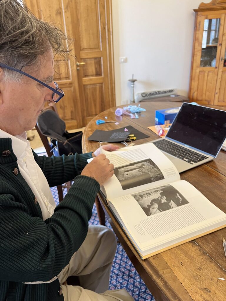 Marco de Grazia with books at Tenuta delle Terre Nere